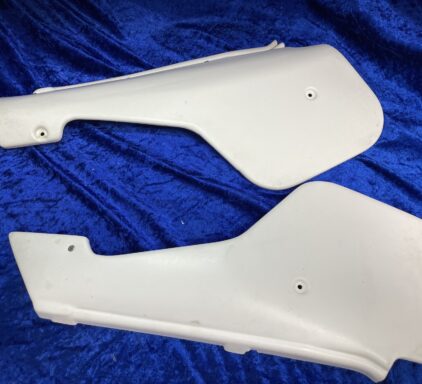 Genuine NOS 1984 Side Panel Pair - 1 set. Side Panels 1984 2t  15-19-775-01 & 15-17-745-01 / 15-17-746-01